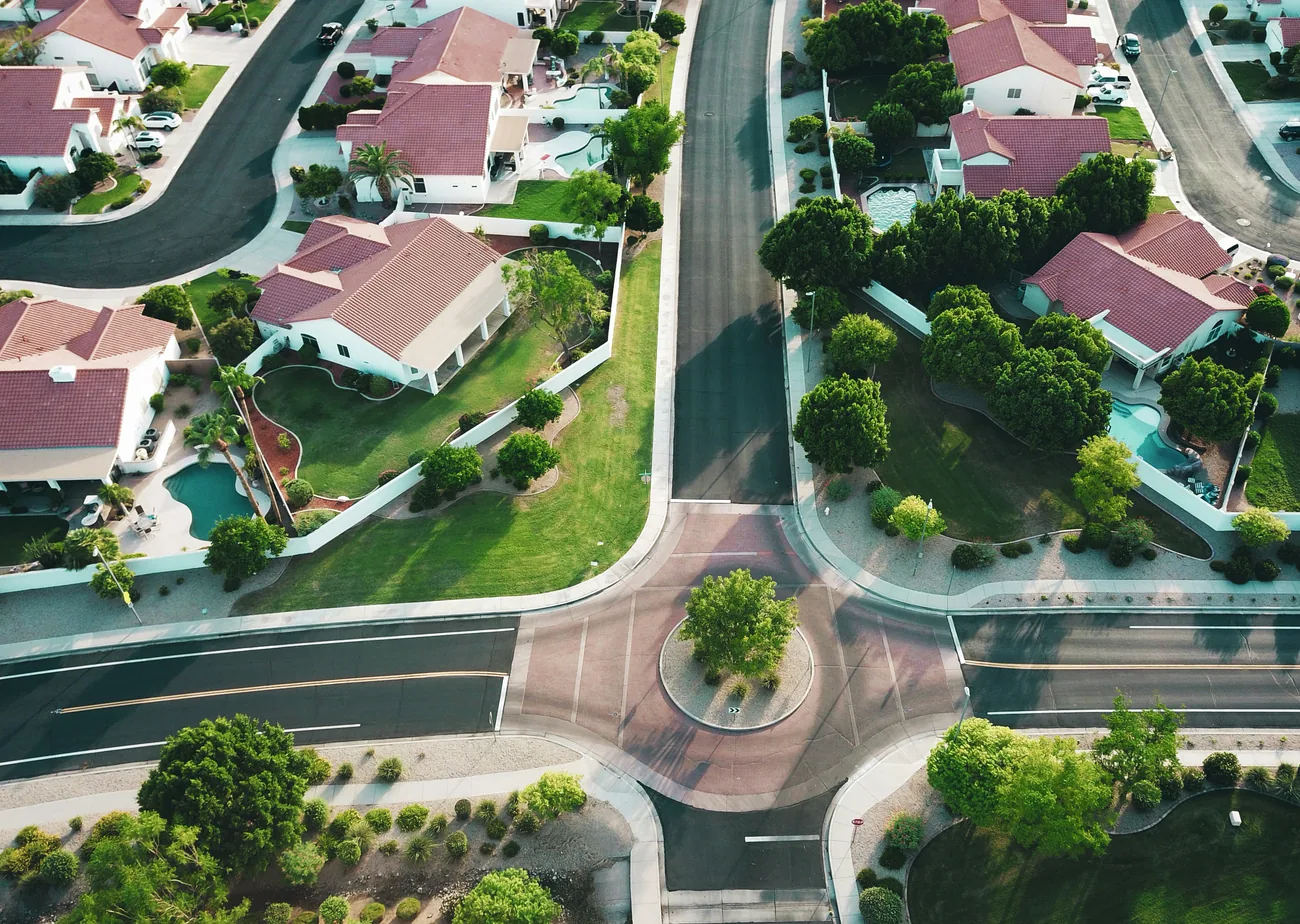 Aerial view of a residential development laid out around a junction