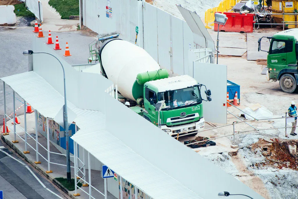 Concrete mixer truck delivering to an inner city construction site