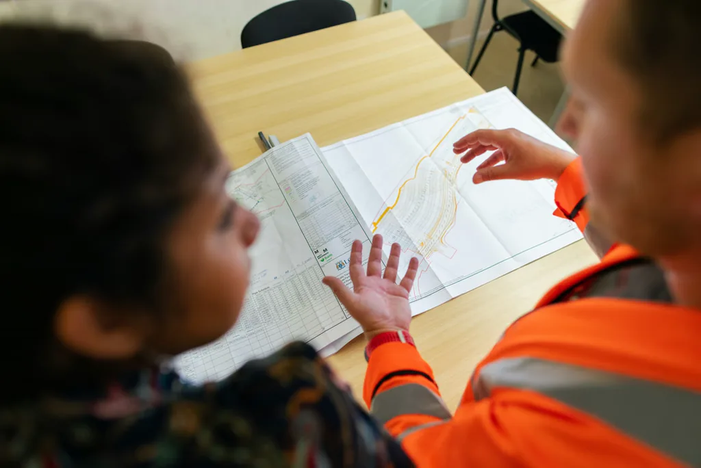 Two engineers reviewing a drawing set against the applicable standards